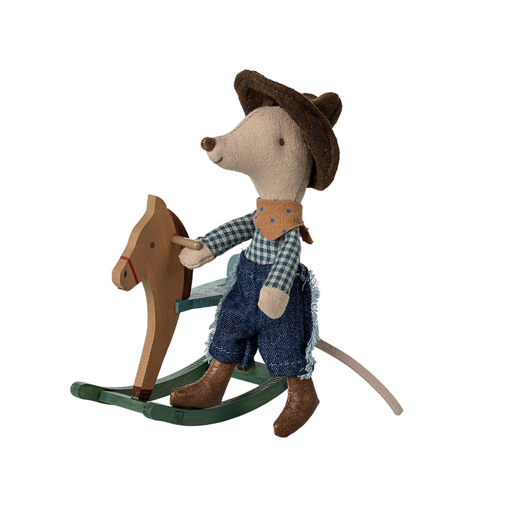 picture shows little brother maileg mouse in a cowboy outfit next to a wooden maileg rocking horse against a white background