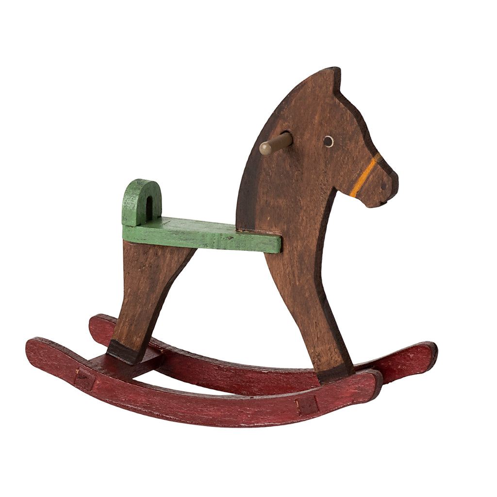 Maileg mouse-sized rocking horse in dark brown wood, accented with a green seat and red rockers.