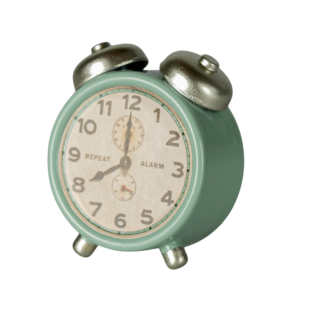 Angled view of the Maileg alarm clock for mice in mint green with silver accents, featuring a retro aesthetic