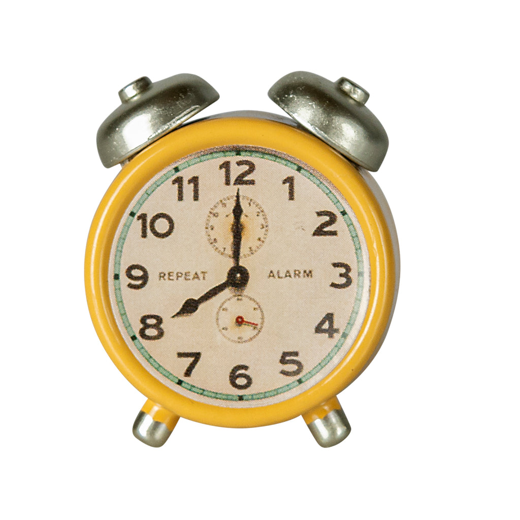 Front view of the Maileg alarm clock in yellow, highlighting its vintage-style aesthetic.