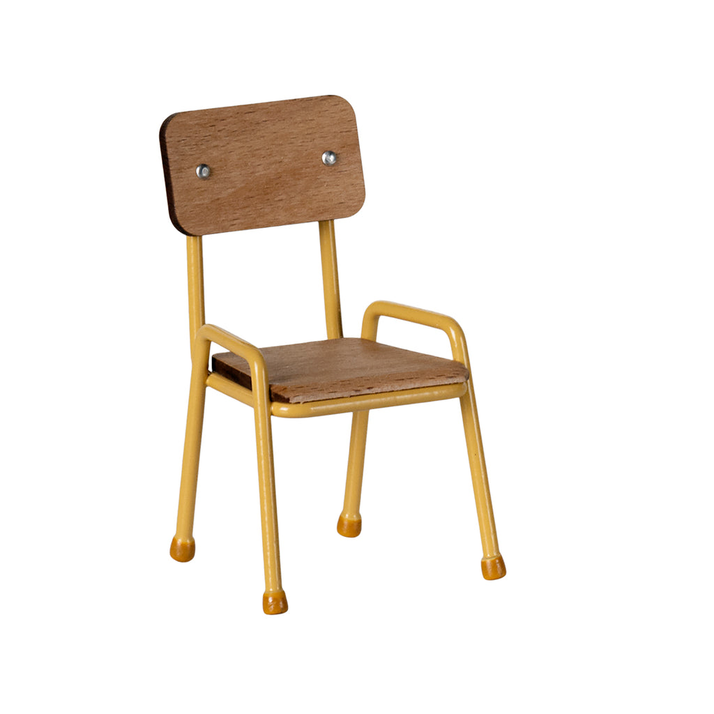 Side view of the Maileg chair in yellow, showcasing its wooden seat and backrest with sturdy metal legs.