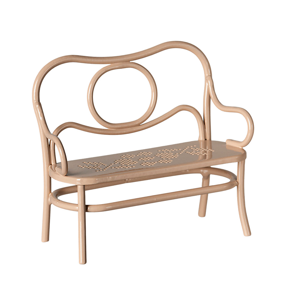 A beautifully crafted Maileg metal bench in pale pink, featuring a delicate hole-punched floral design on the seat.