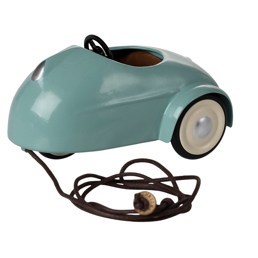 Maileg light blue pull-along car for mouse with white wheels and a brown cord.