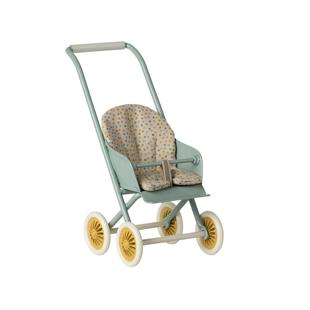 A charming Maileg micro-sized stroller in soft mint, featuring a delicate floral fabric seat and yellow-accented wheels.