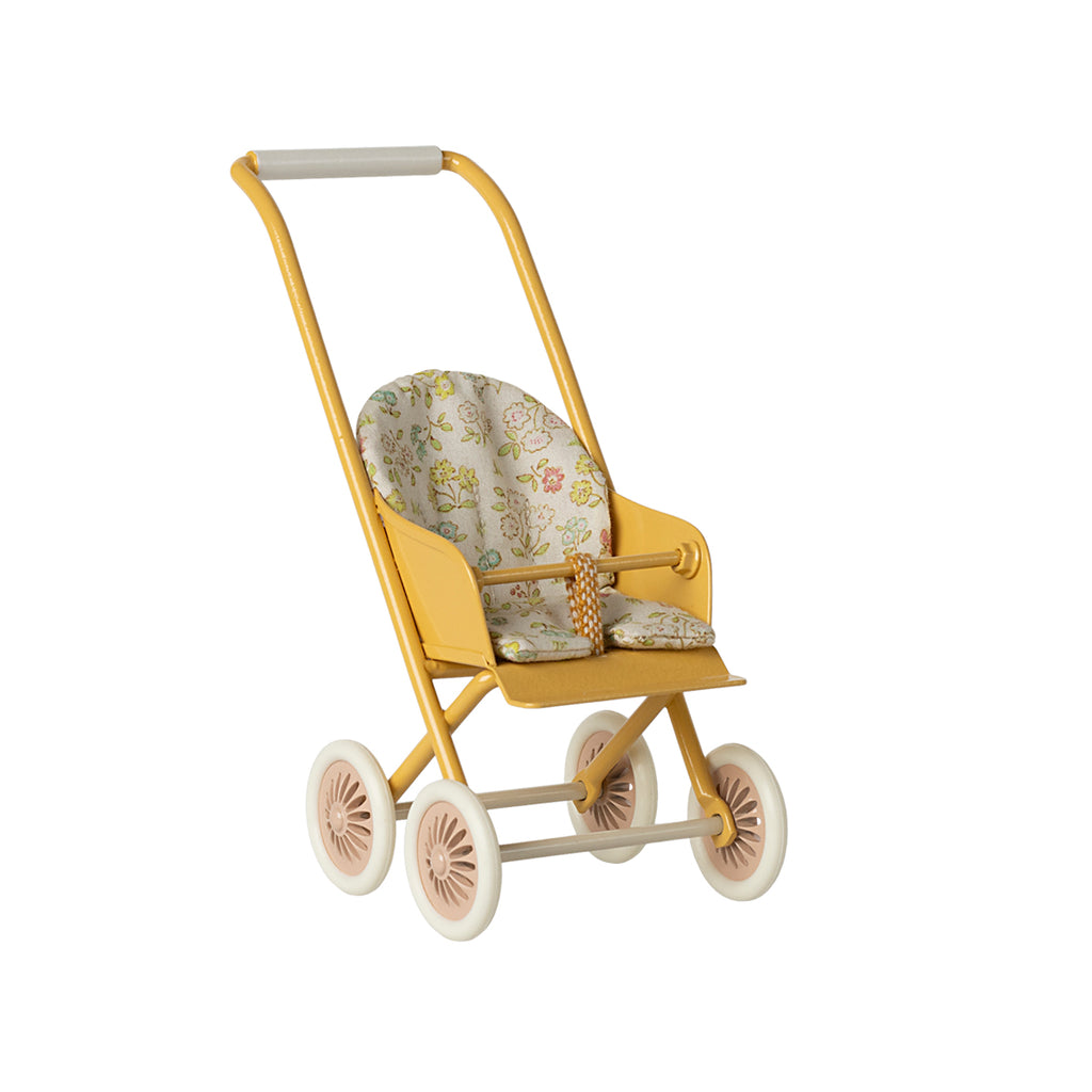 A charming Maileg micro-sized stroller in bright yellow, featuring a delicate floral fabric seat and pink-accented wheels.