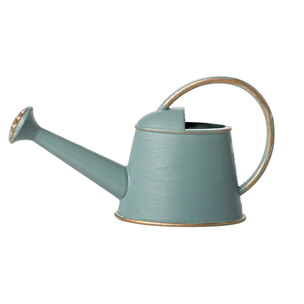 A side-facing view of the Maileg watering can in light blue, showcasing its classic design with gold-accented details.