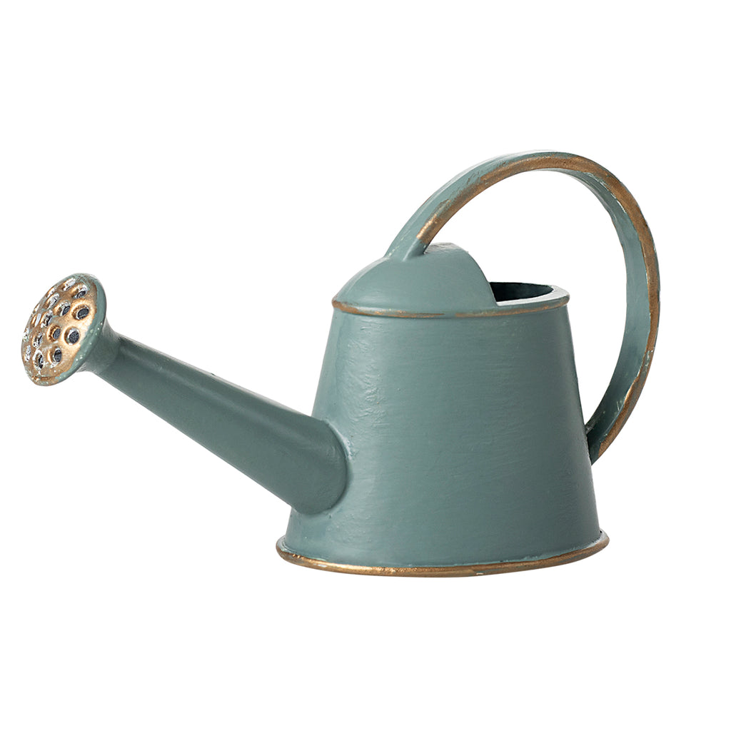 A beautifully crafted Maileg watering can in soft light blue, featuring elegant gold accents on the handle and spout.