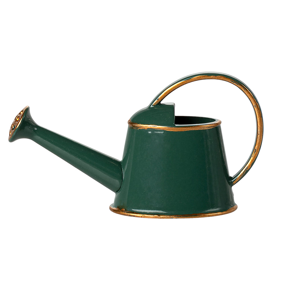 A side-facing view of the Maileg watering can in dark green, showcasing its classic design with gold-accented details.