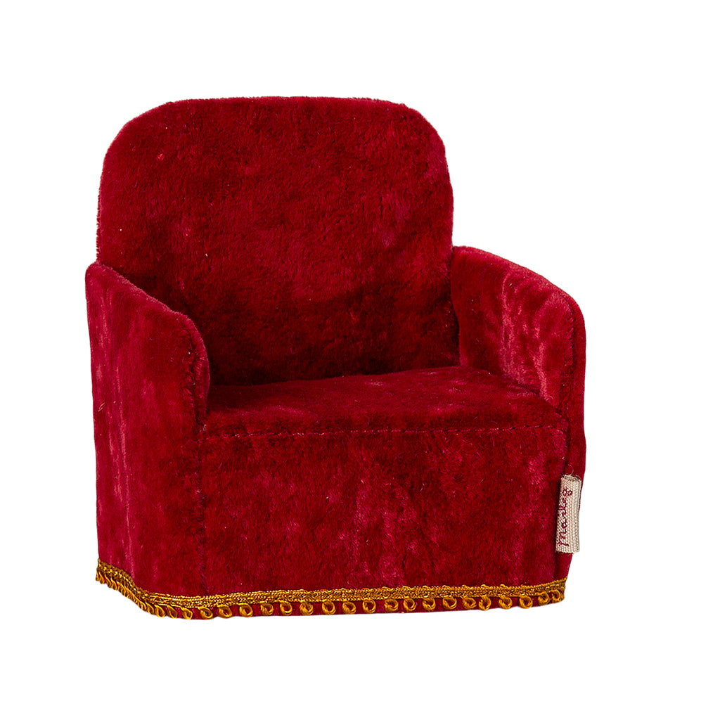 A charming Maileg folding chair in a bold red colour, shown from the side. Perfectly sized for Maileg mice and miniature settings.