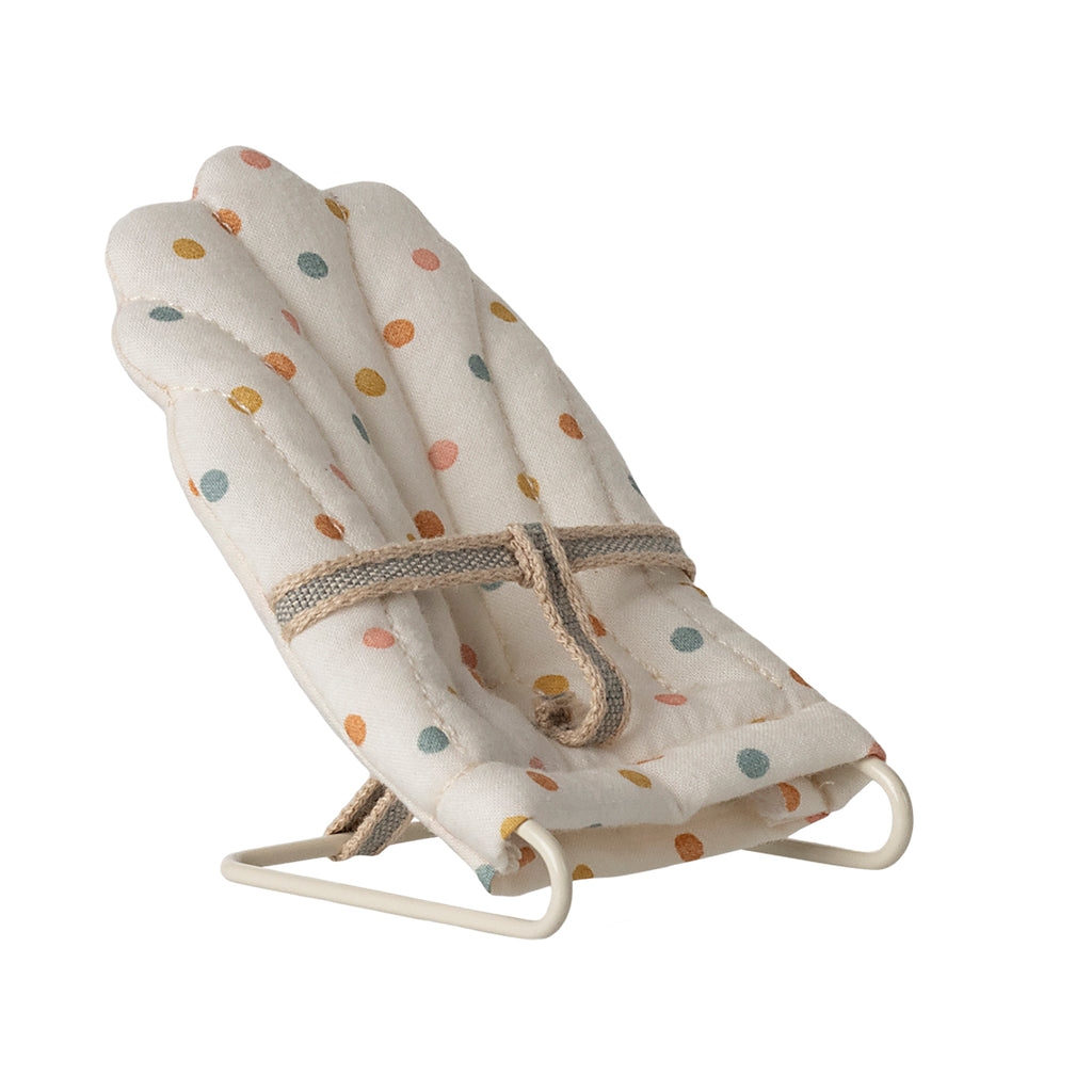 A tiny Maileg babysitter in a charming multi-dot pattern, designed for Maileg My-size rabbits and mice. The perfect accessory for little ones to rest in style.