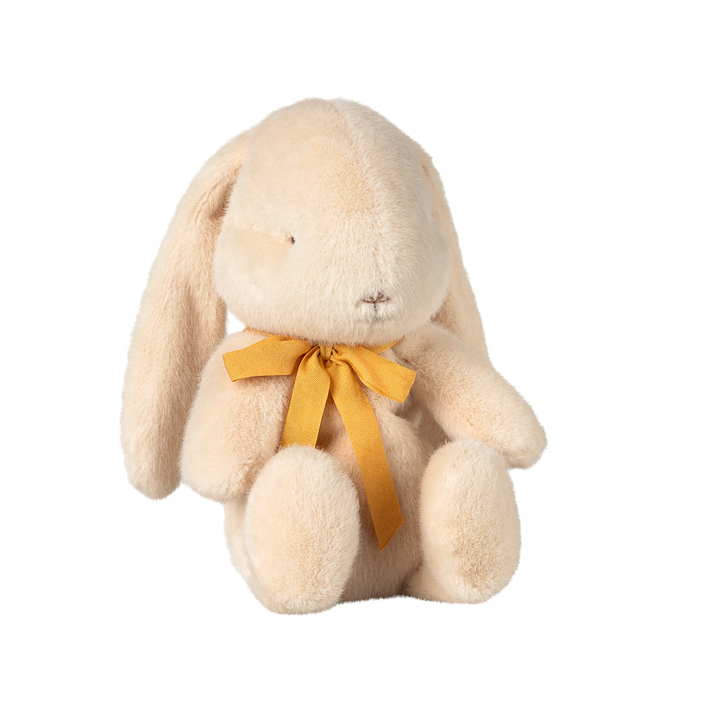 A charming Maileg small bunny plush in cream, sitting gracefully with a cheerful yellow bow tied around its neck.