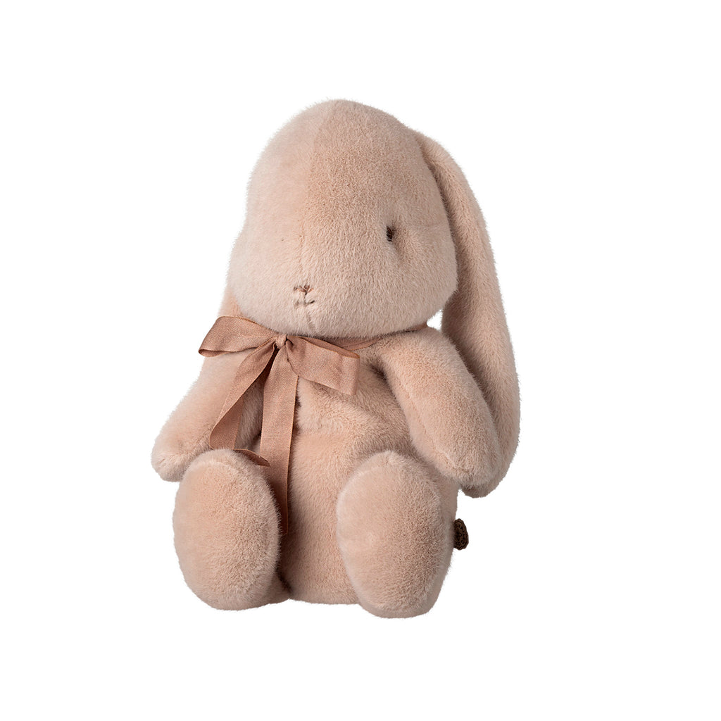 The same Maileg medium bunny in light powder, featuring its charming pink bow and sitting pose from a different perspective.