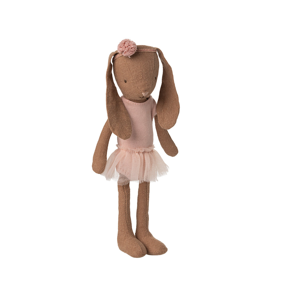 A chocolate-coloured Maileg bunny wearing a pink ballet dress and matching pom-pom headband.