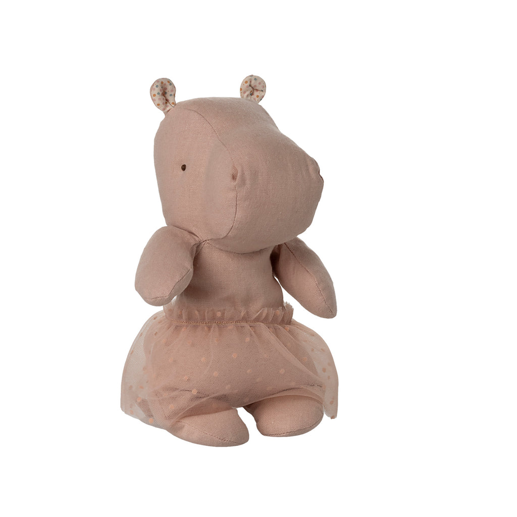 Sitting view of the Maileg Safari Friends hippo plush in soft rose, featuring its polka-dot skirt