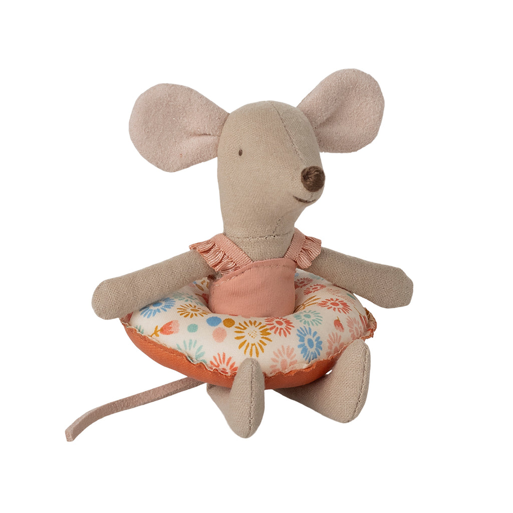 Maileg beach mouse in a floral swimsuit sitting on a flower-patterned float.