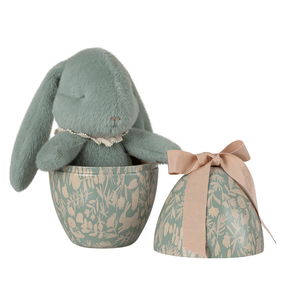 Maileg mint plush bunny with lace collar, sitting inside a mint Easter egg with floral patterns, lid beside it.