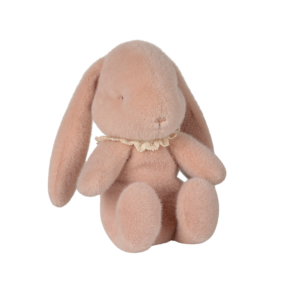 Soft Maileg bunny plush in powder pink, sitting with a delicate lace collar