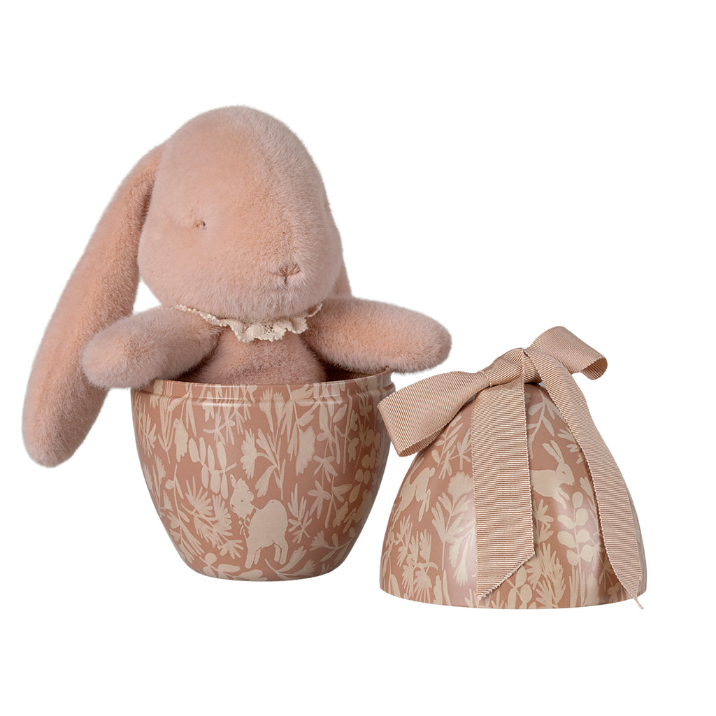 Maileg bunny plush in a decorative powder Easter egg, detailed with nature-inspired patterns.