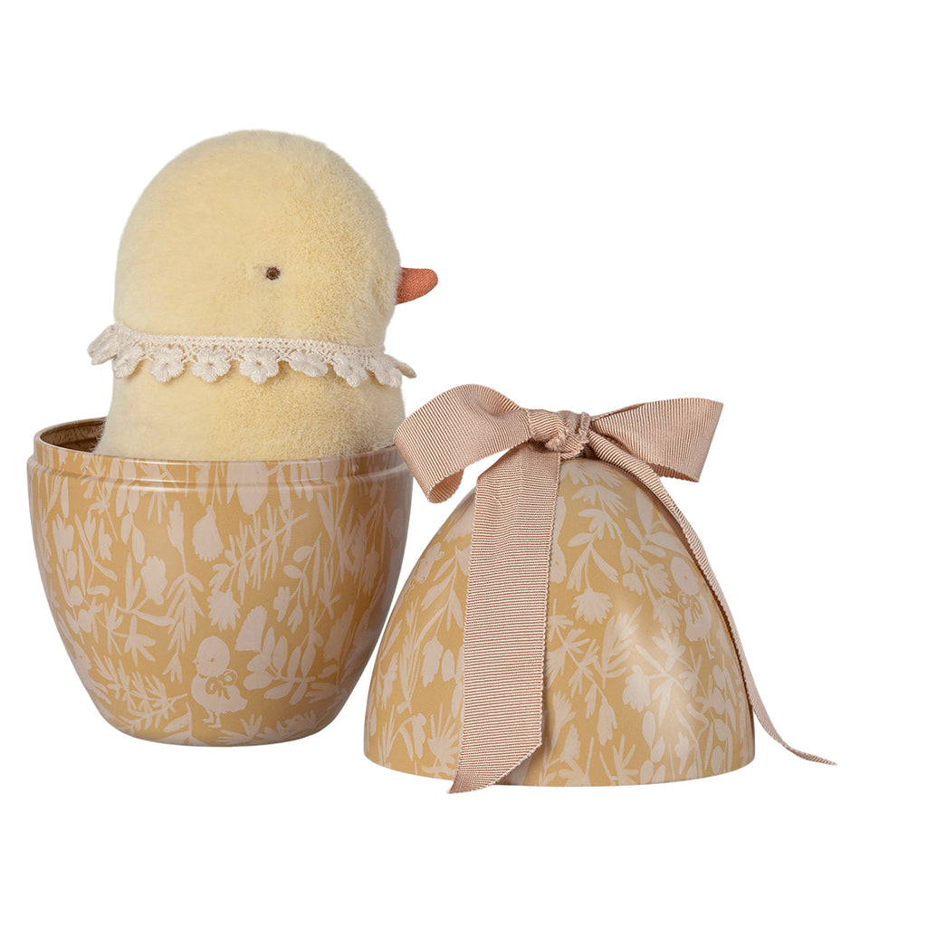 Yellow Maileg chick plush toy tucked into a cream-yellow Easter egg with floral design