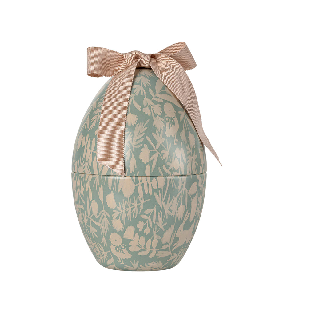 Closed Maileg Easter egg in mint green with cream floral illustrations and a bow on top.