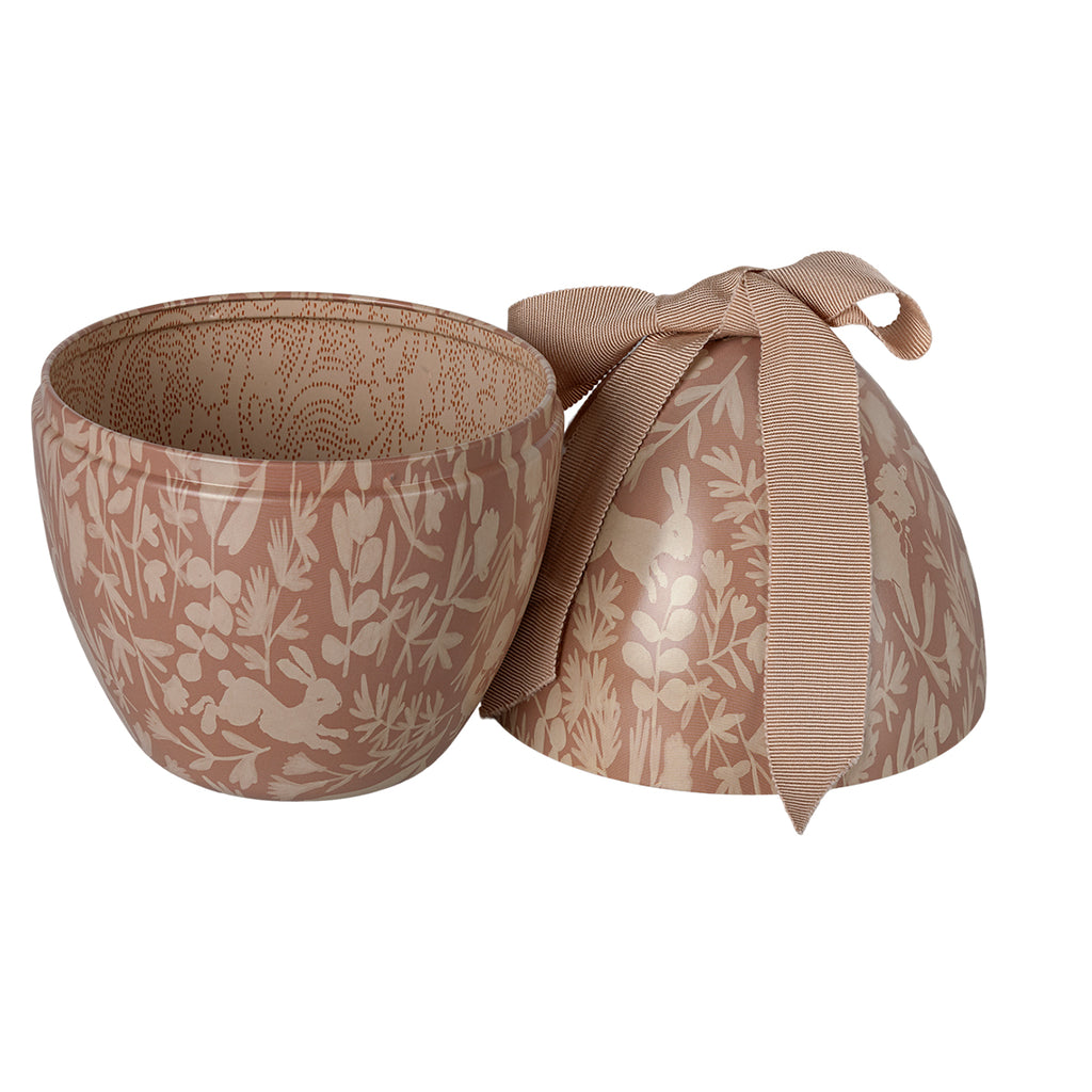 Open Maileg Easter egg in powder pink, revealing its patterned interior and ribbon closure