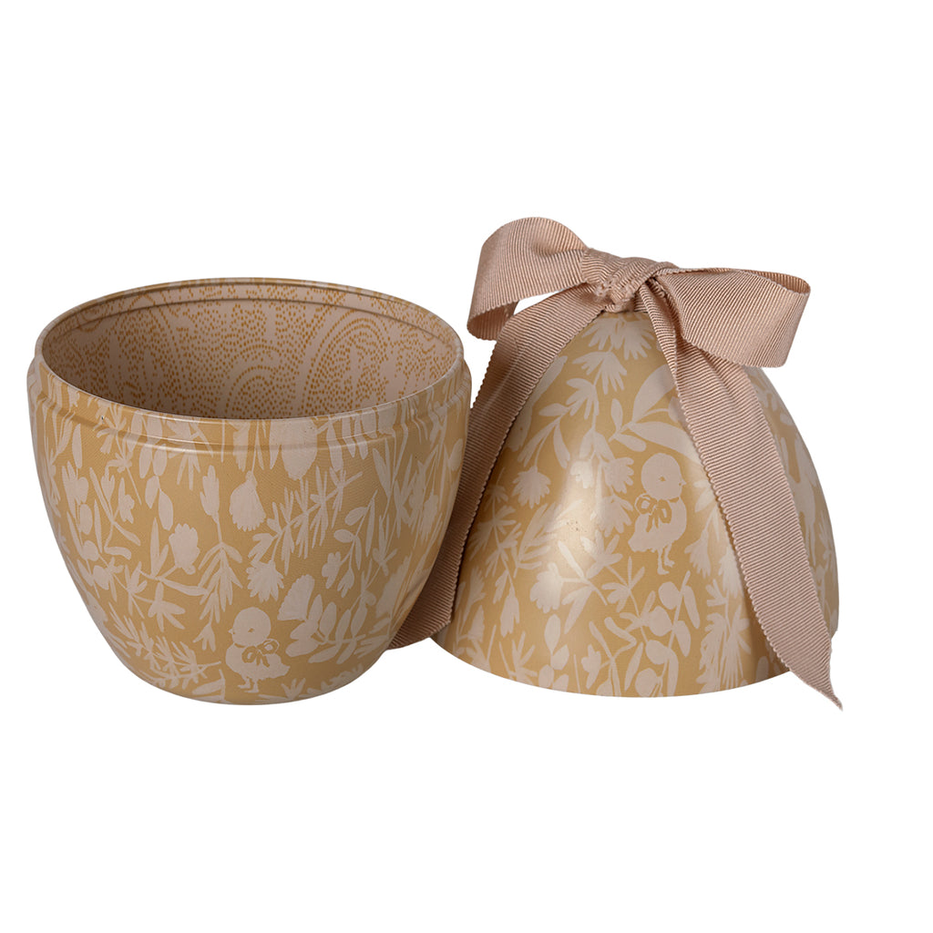 Interior view of Maileg Easter egg in cream yellow, showcasing its decorative lining and elegant ribbon tie