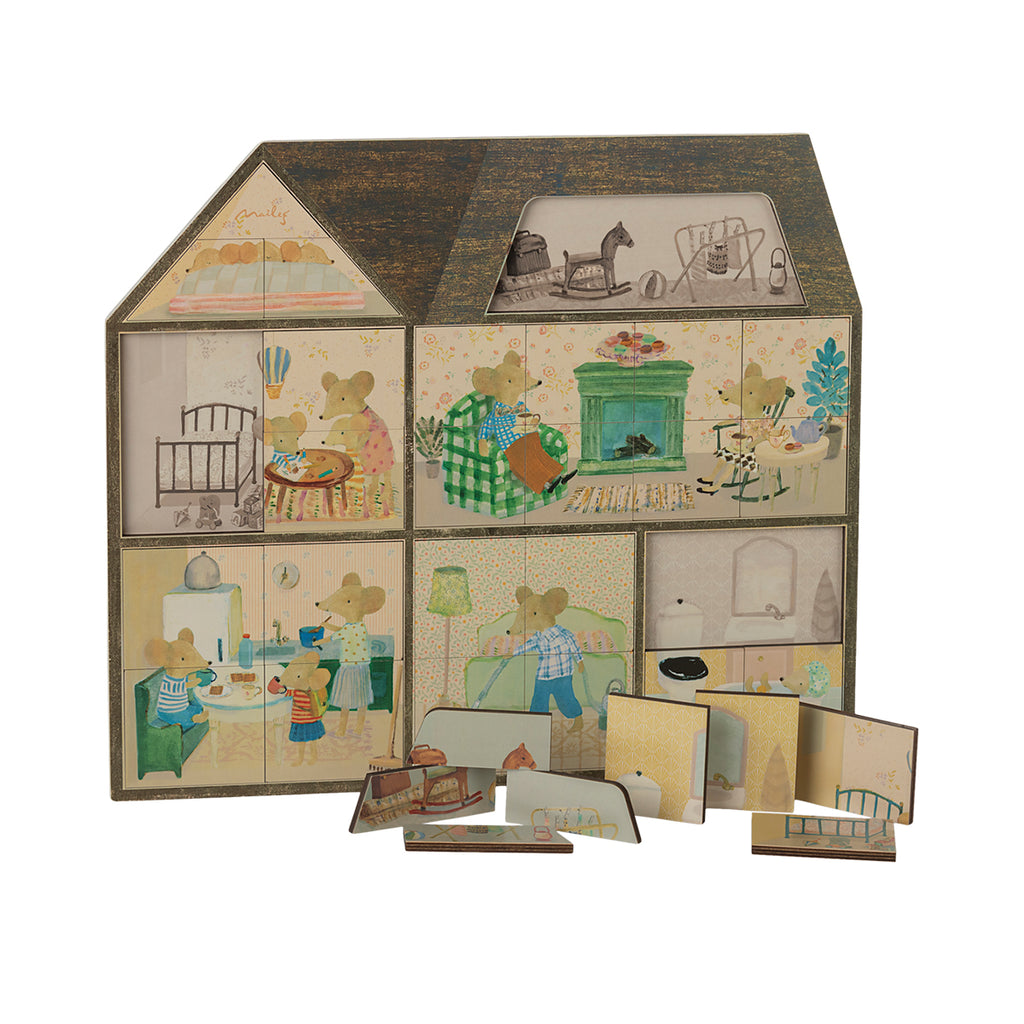 Maileg mousehole farmhouse puzzle, featuring a detailed illustration of a mouse family home with removable pieces.