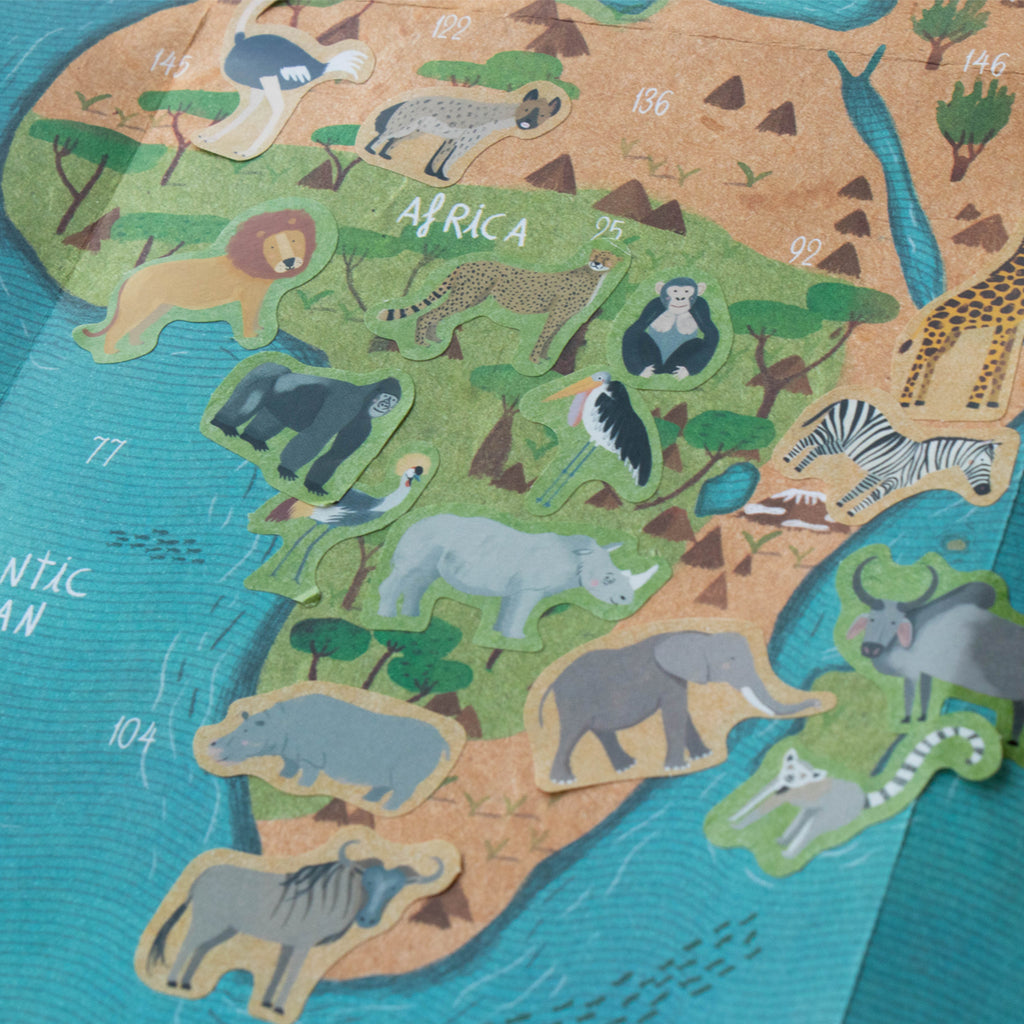 Londji Animal World sticker sheet with animals placed on the corresponding regions of the illustrated world map.
