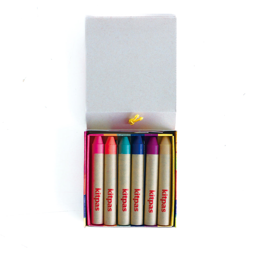 Kitpas Ecru 6 Colour Crayons set open, revealing six colourful crayons inside a compact case