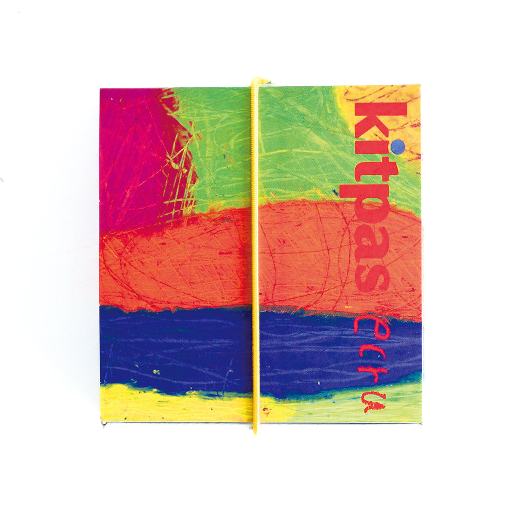 Kitpas Ecru 6 Colour Crayons packaging with a colourful abstract design and yellow string closure.