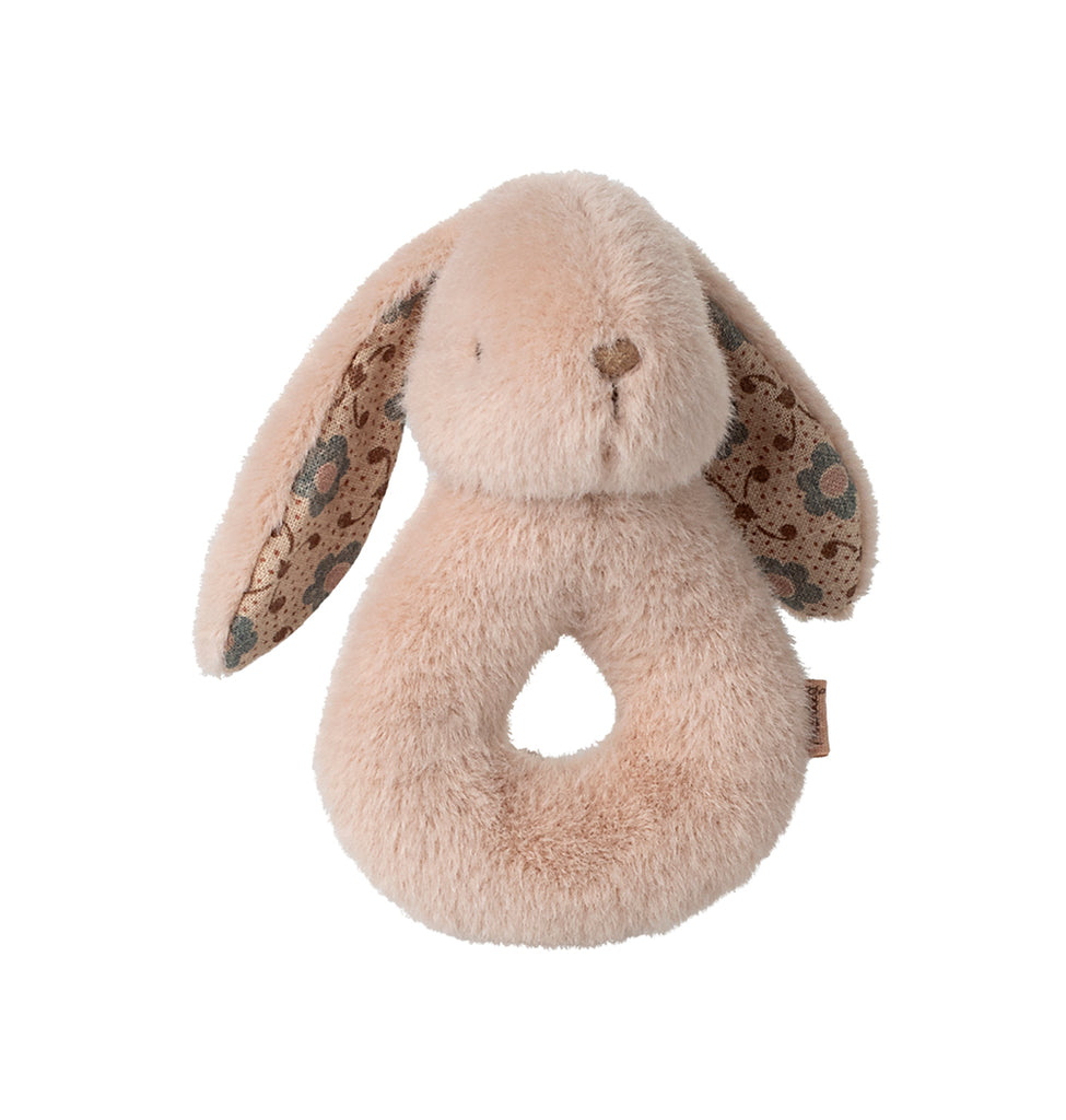 Close-up of the powder Maileg rabbit rattle with soft cotton texture