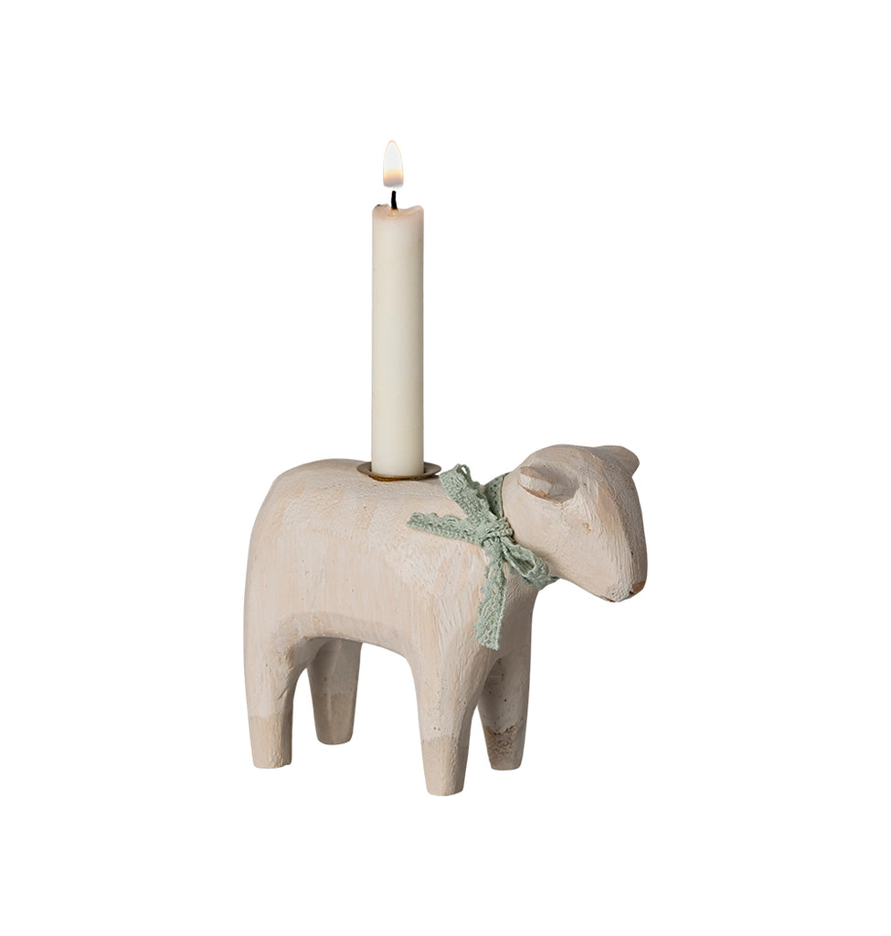 Maileg lamb candle holder in mint with a lighted candle and bow accent