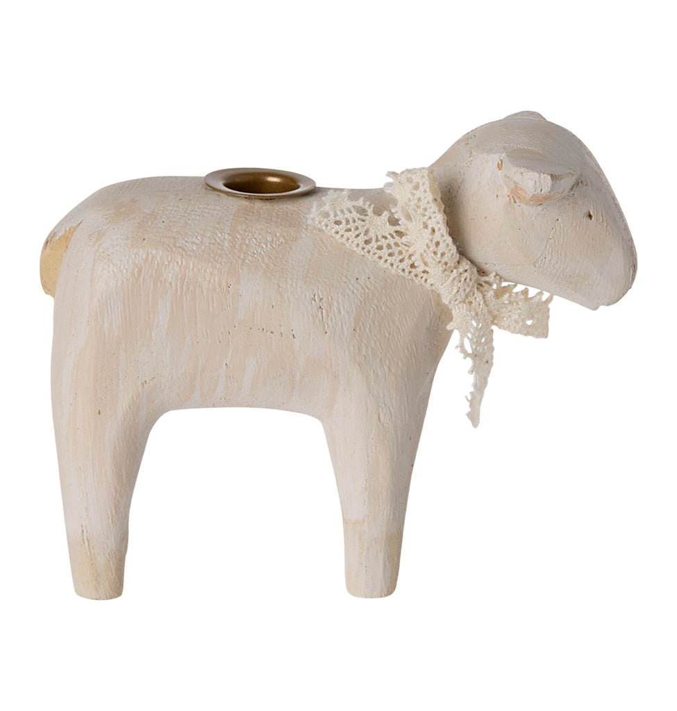 Close-up of Maileg off-white lamb candle holder with intricate lace detailing.