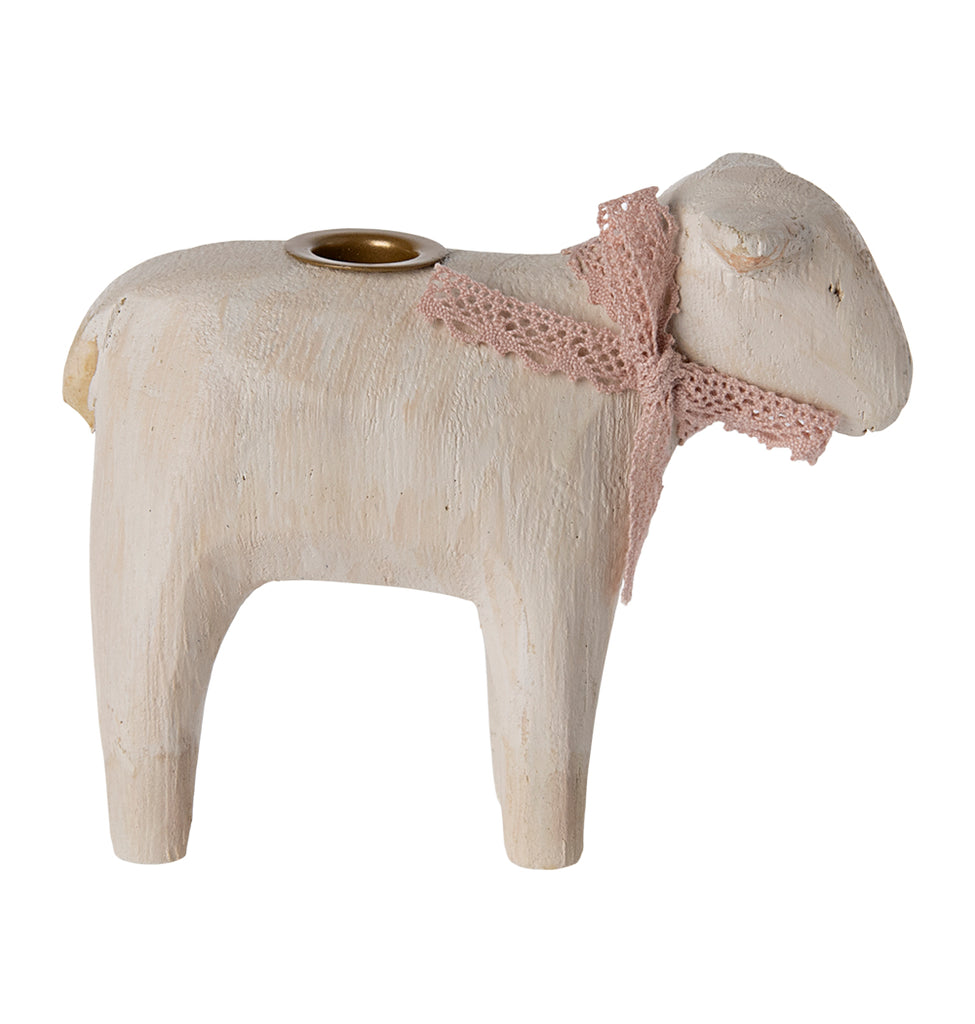 Maileg candle holder shaped like a lamb, with a pink ribbon and candle.