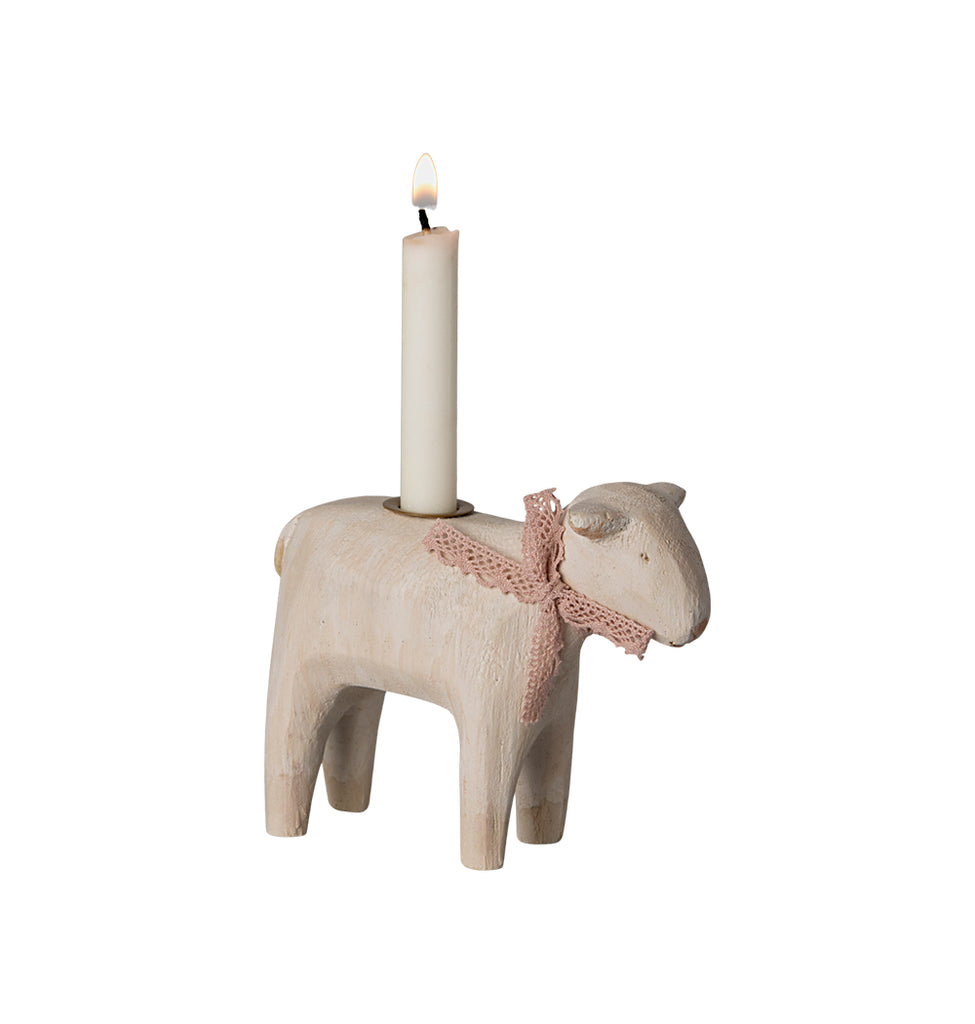 Maileg candle holder shaped like a lamb, with a pink ribbon and candle.