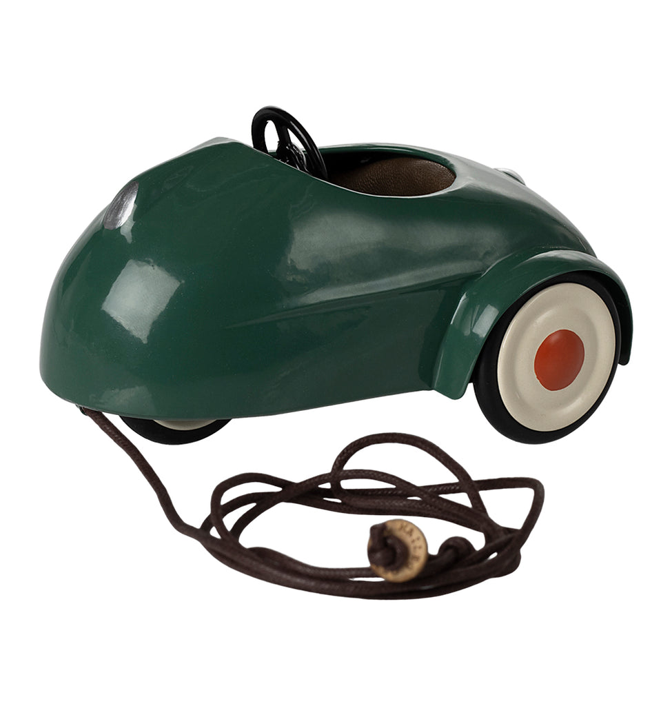 Maileg dark green pull-along car for mouse with white wheels and a brown cord.