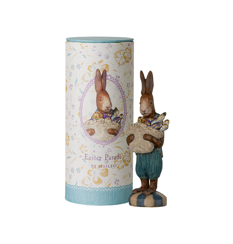 Maileg Easter Parade Bunny figurine holding a basket of eggs, standing on a striped base.